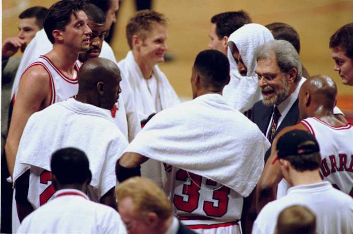 Chicago Bulls coach Phil Jackson, right, with team (clockwise from Phil) Scott Burrell (24), Scottie Pippen (33), Michael Jordan (23), Toni Kukoc (7), Dickey Simpkins (8), Steve Kerr (25) and Dennis Rodman (91)
